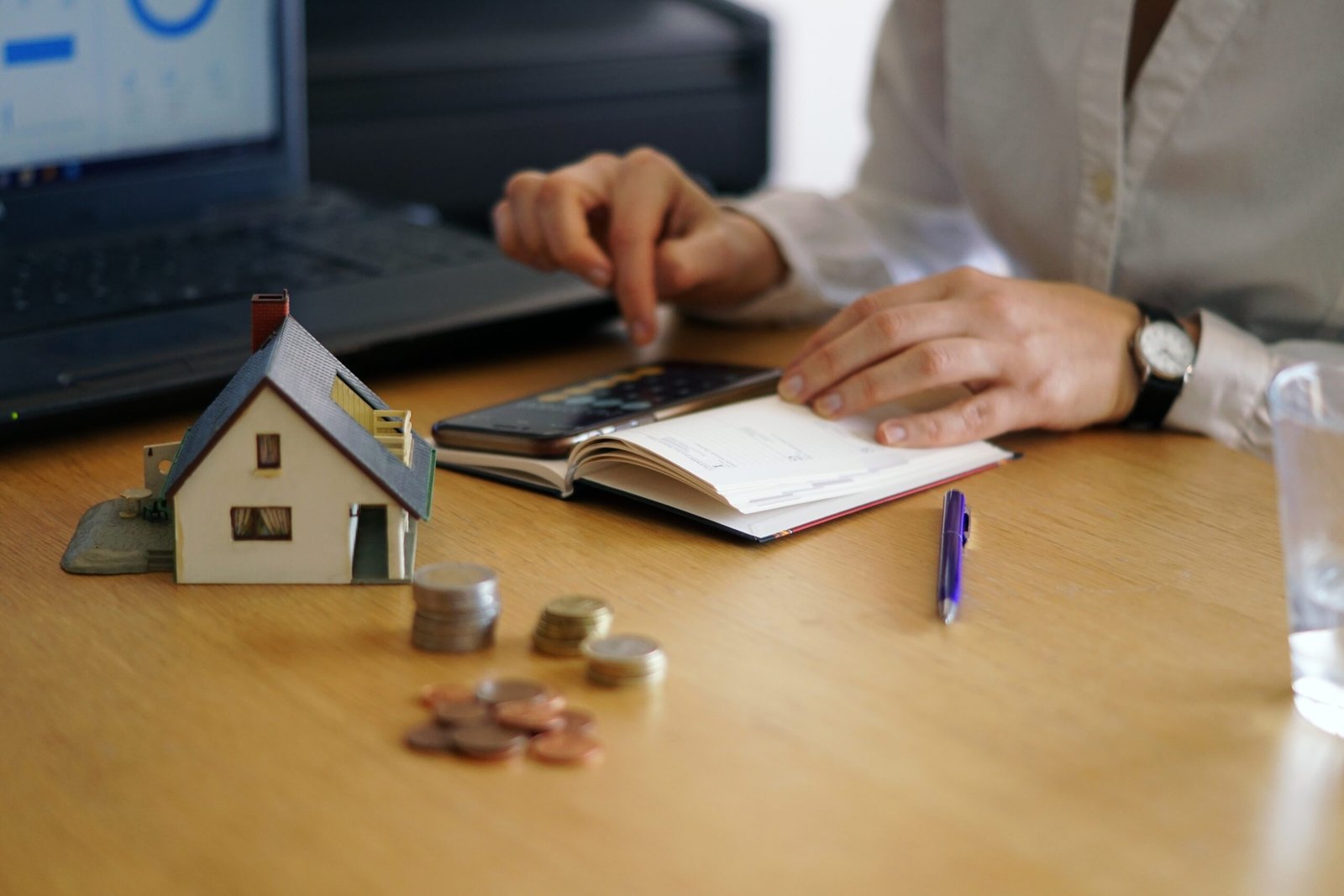 closeup shot of a person thinking of buying or selling a house