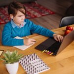 online learning, boy using laptop
