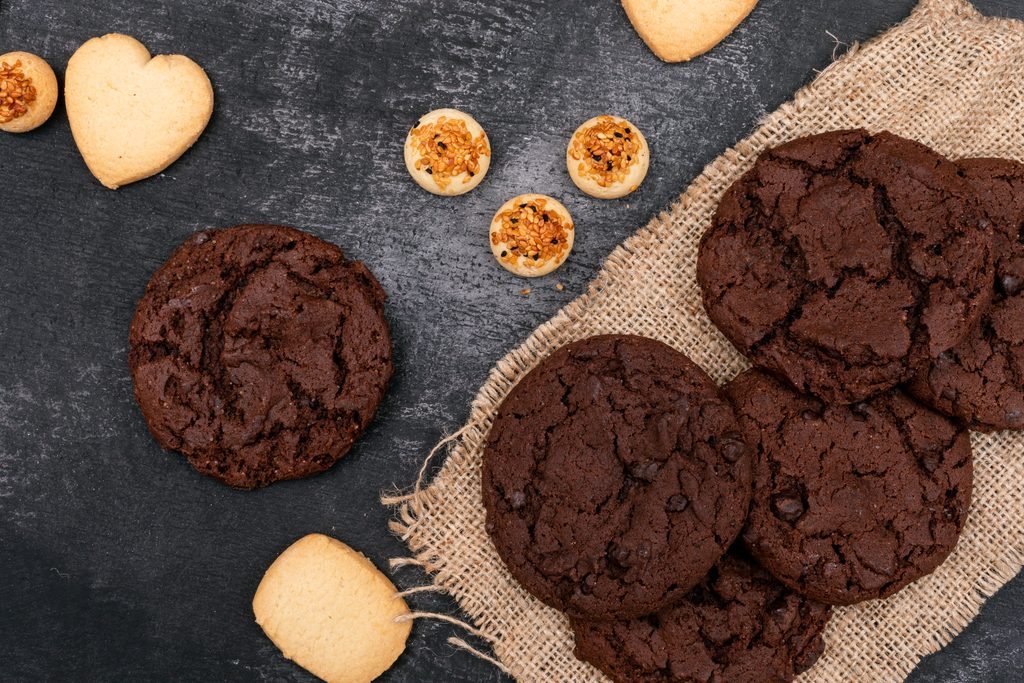 Gourmet Cookie Flavors: Delicious Ideas for Every Occasion top view, different cookies on dark background